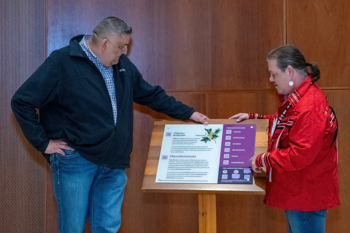 Chief KillsCrow (left) and Mr. Jeremy Johnson (right) of the Delaware Tribe of Indians examining one of the signs that will be installed in the Gordon