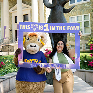 thumbnail, student standing with Rammy in front of the ram statue