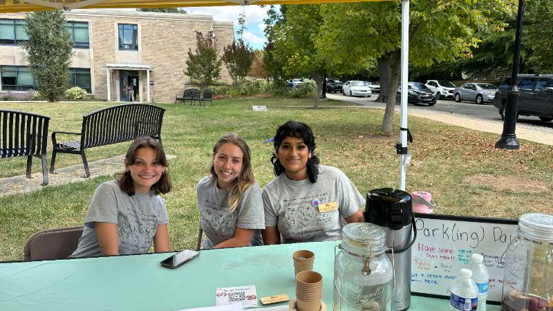 Three Sustainability Peer Educators at Park(ing) Day 2025