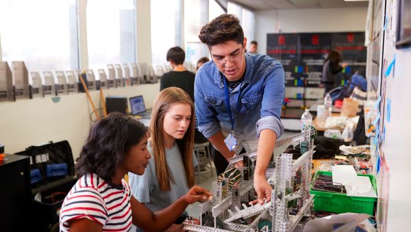 Faculty working with students in lab