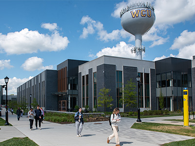 Students walking on campus infront of the secc building