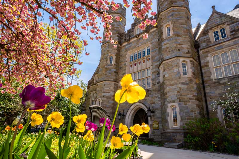Spring Campus Shot of Asplundh surrounded by flowers