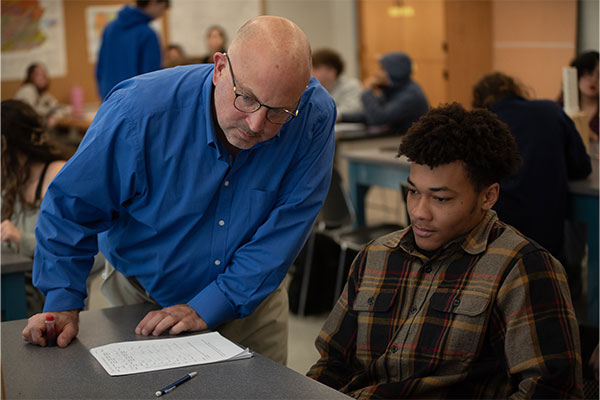 Teacher and student in classroom