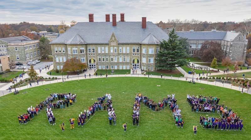 Students on the quad creating the word 'rams'