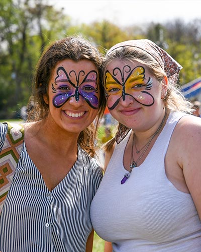 Two female students with their face painted