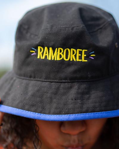 Cose up shot of a bucket hat that says 'Ramboree'