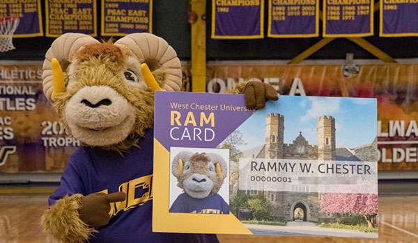 Picture of Rammy holding up a Ram Card