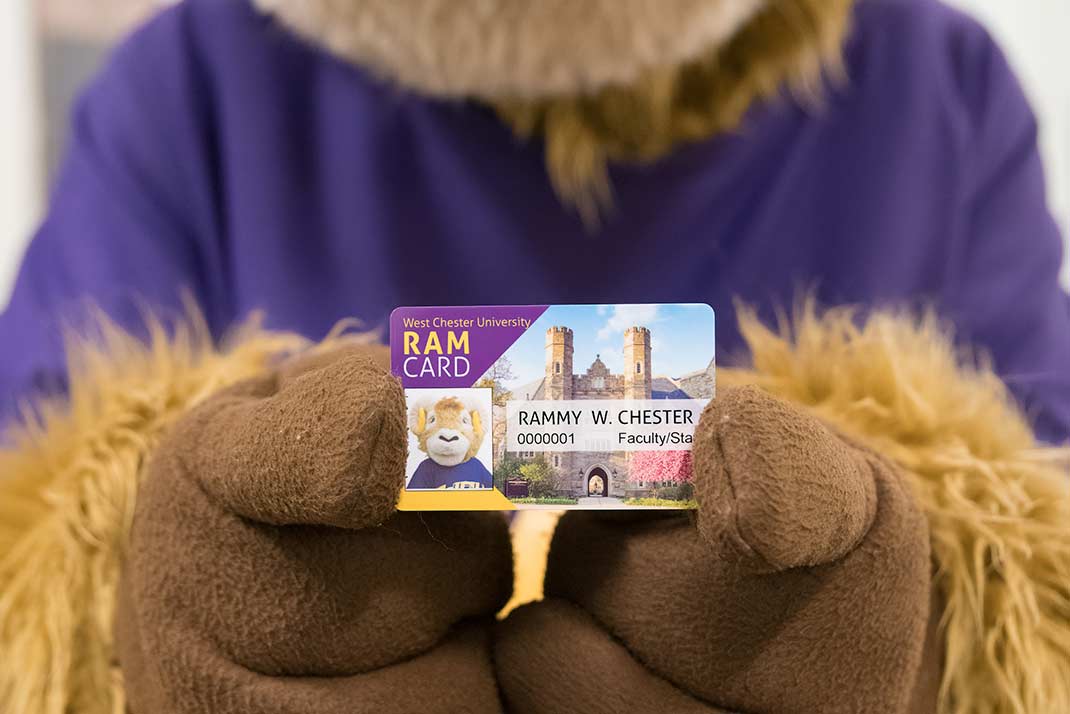 Rammy holding an ID Card