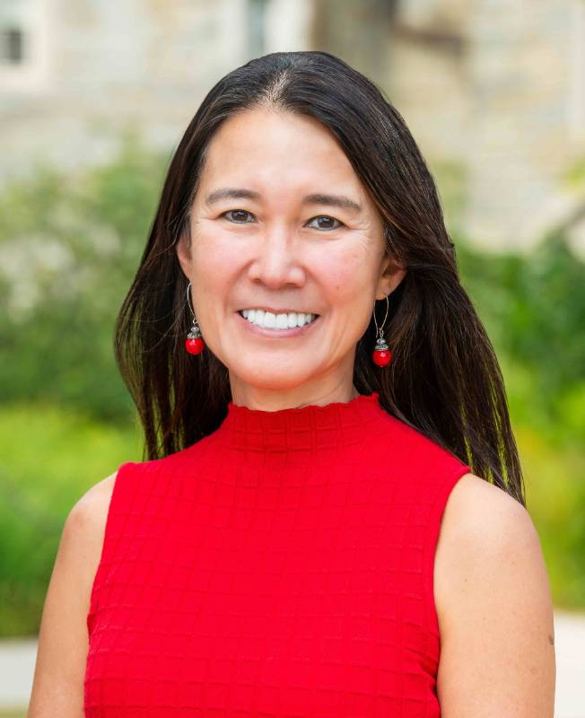 Bessie Lawton headshot Headshot of Bessie Lawton in red top