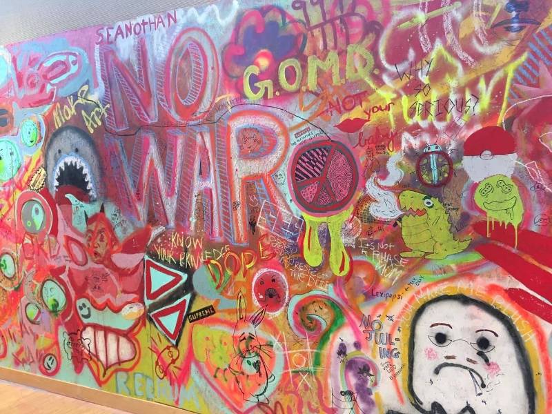 Photo Wall of Grafitti including the words, "Make Art not War." Taken by D Johnson at "The Skate Show" See https://wcupa.edu/communications/newsroom/2019/10.21SkateShow.aspx