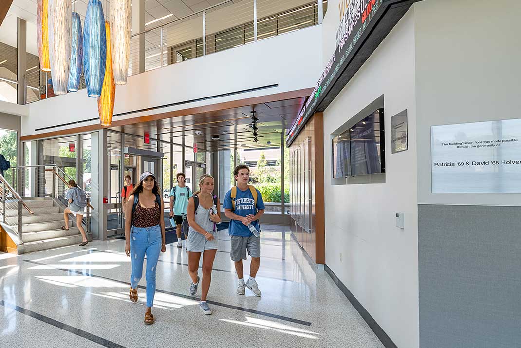 Business Students walking through the BPMC buiding