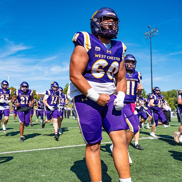 WCU football Players getting hyped up to start the game