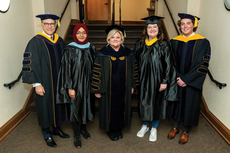 Dr. Bernotsky and COT member Chris Franklin ’87 (L) with student leadership (L-R) Matheeha Majeeth, McKenna Nugent, and Chris Needham.