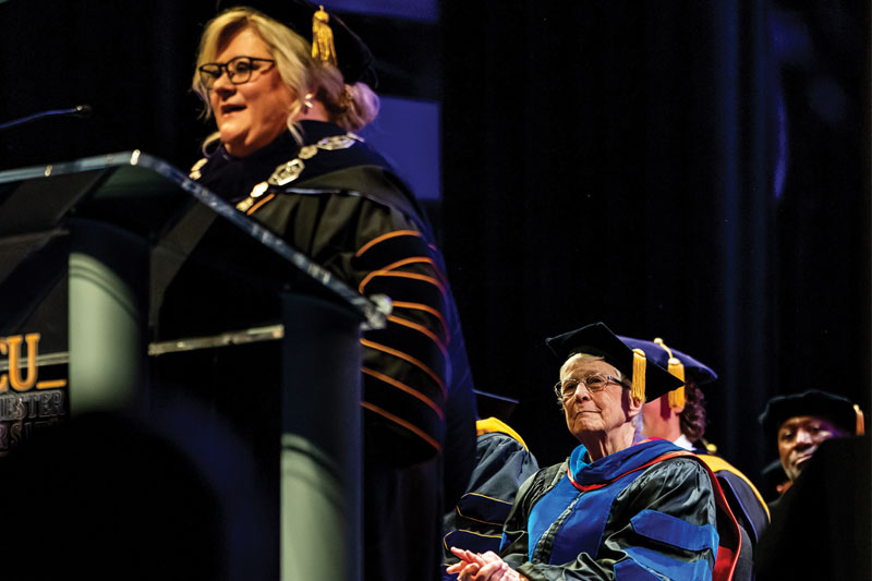 Dr. Madeleine Wing Adler listening to Dr. Bernotsky