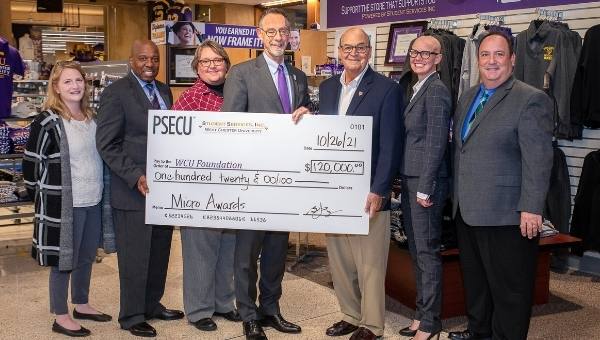 Pictured (L to R) attending the $12,000 check presentation from Student Services, Incorporated and PSECU are Deputy Director of Financial Aid Tori Nuccio; Vice President for Student Affairs Zebulun Davenport; Executive Director of Student Services, Incorporated Donna Snyder; West Chester University President Chris Fiorentino; Student Services, Incorporated Chair of the Board of Directors Bernie Carrozza; Community Manager at the PSECU Financial Education Center – West Chester Amanda Altice; and West Chester University Foundation Chief Executive Officer Chris Mominey.