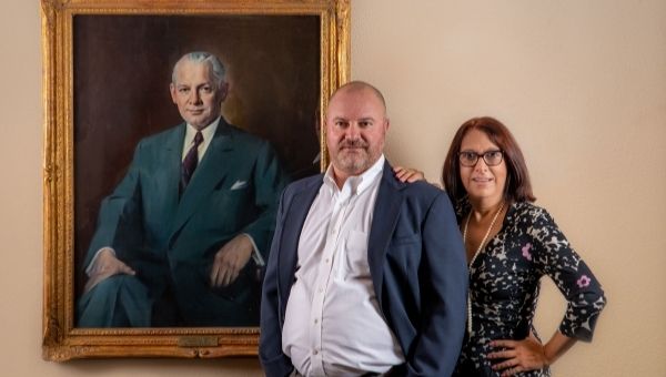 Pictured standing next to the portrait of their grandfather, Charles S. Swope ’21, who was president of West Chester State Teachers College from 1935 through 1959, are (l to r) cousins Charles (“Chuck”) E. Swope, Jr. and Dawn Swope Apgar.