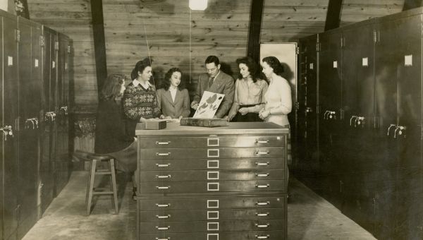 A natural history class circa 1940s examining a Darlington Herbarium specimen with Dr. Robert B. Gordon from the library’s WCU Historic Photograph Collection (P-2769).