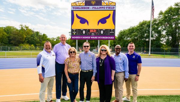(L to R) Pictured standing in front of the Roger & Agnes Ware Scoreboard are Vice President of University Affairs and Chief of Staff Andrew Lehman, Director of Athletics Terry Beattie, Agnes Ware, Roger Ware ’82, West Chester University President Dr. Laurie Bernotsky, Vice President for University Advancement and External Affairs Dr. Zebulun Davenport, and Interim President of Commonwealth University Dr. Jeffery Osgood, Jr. 