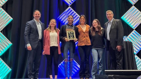 (L-R) Sean Ferns, DEA, Bridget Looby, assistant director of Wellness Promotion, Jaiona Johnson, Alicia Boyer, Jenna McLean (all three Wellness Promotion Peer Educators), Richard Lucey, DEA, at the awards presentation at the NASPA Strategies Conference. (L-R) Sean Ferns, DEA, Bridget Looby, assistant director of Wellness Promotion, Jaiona Johnson, Alicia Boyer, Jenna McLean (all three Wellness Promotion Peer Educators), Richard Lucey, DEA, at the awards presentation at the NASPA Strategies Conference.
