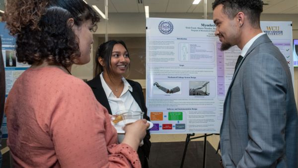 Students pitching ideas and research