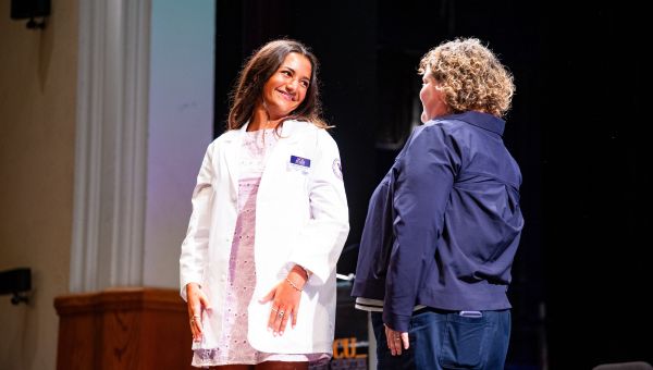 Student accepting her White Coat at the WCU Physician Assistant Program White Coat Ceremony Student accepting her White Coat at the WCU Physician Assistant Program White Coat Ceremony