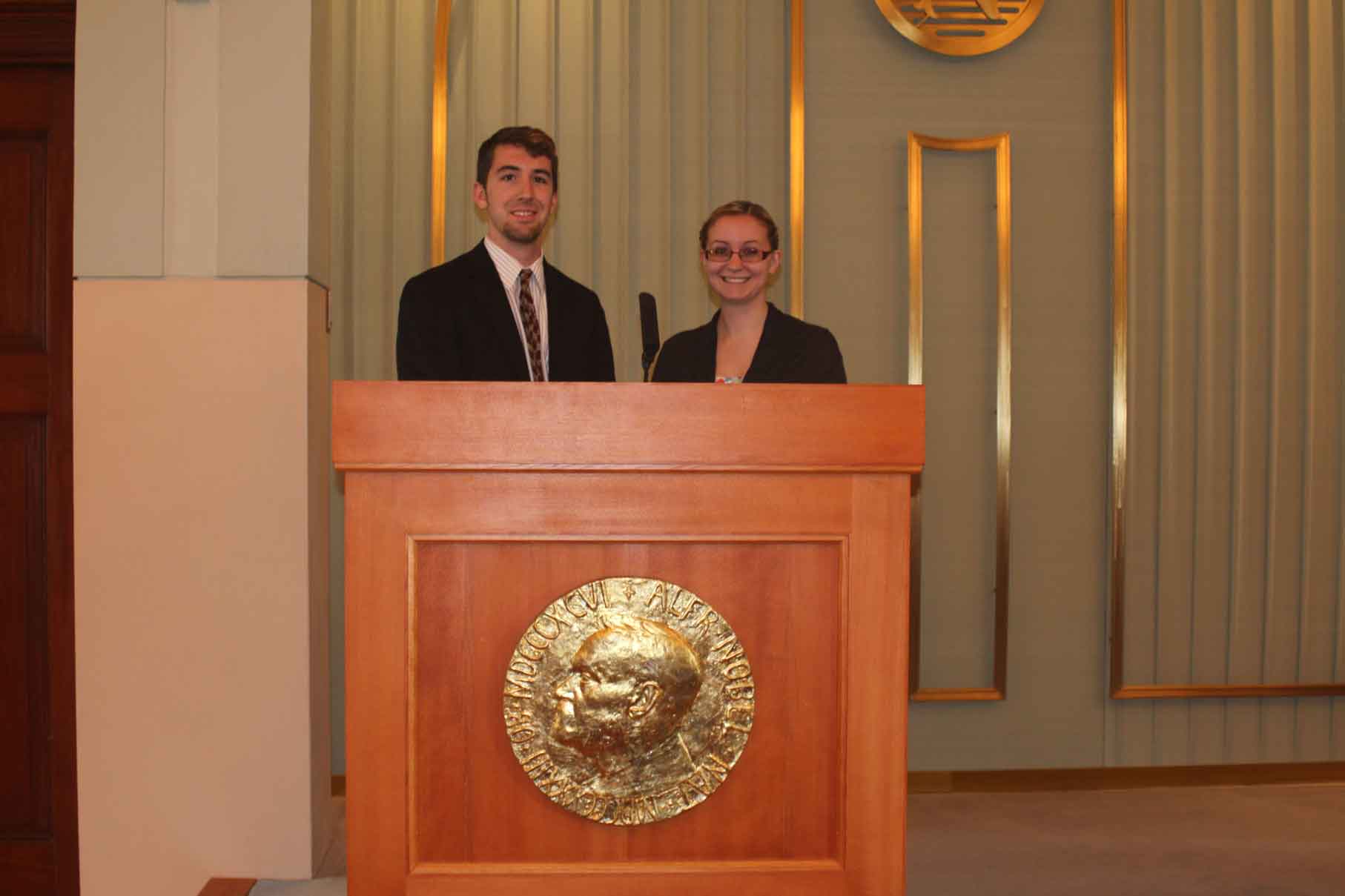 Two people at a podium 2