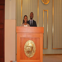 Thumbnail: Two people at a podium 1