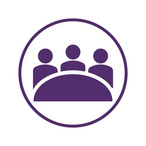 three people icons sitting behind a table in a purple circle