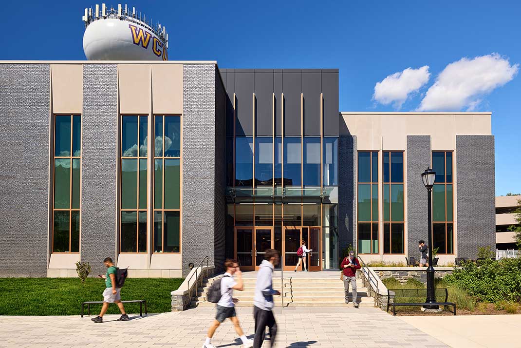 Students walking infront of new building