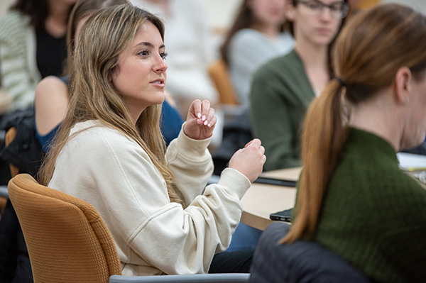 Female student asking question in class setting