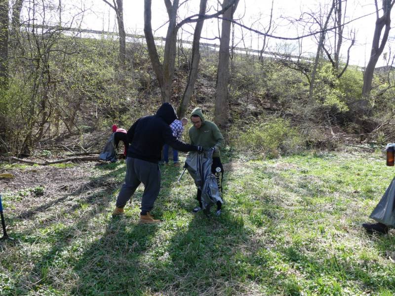 Members of the Friar's Society collecting refuse along the base of the Rte. 202 ramp