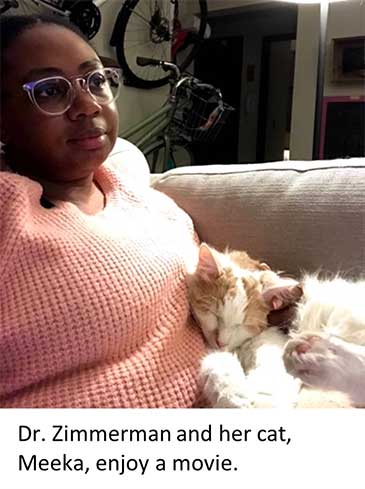Dr. Zimmerman and her cat, Meeka, enjoy a movie.