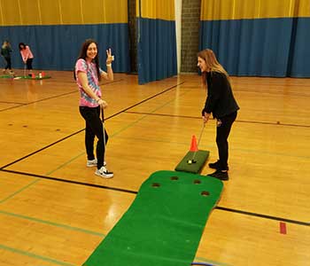 Students playing golf