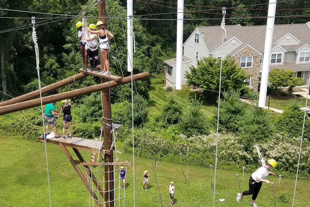 
						Students on a ropes course
					