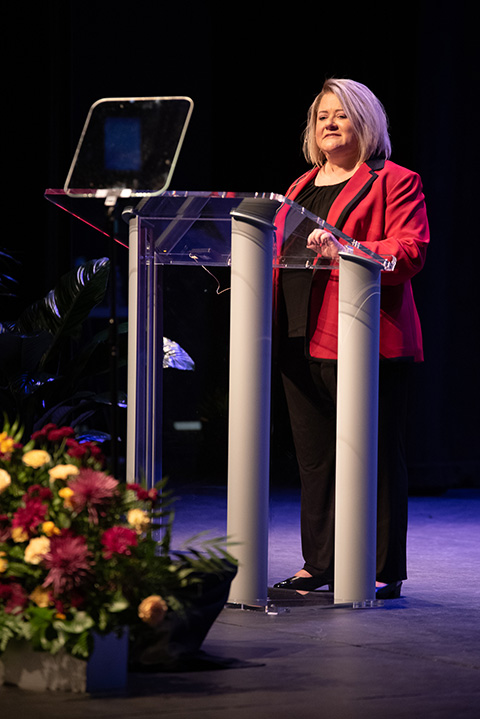 Laurie Bernotsky speaking at a podium