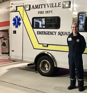 Joseph LaManna infront of emergency response vehicle