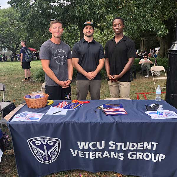 Chris Hollowood, center, and other members of the Student Veterans Group seen last year at a campus event. 