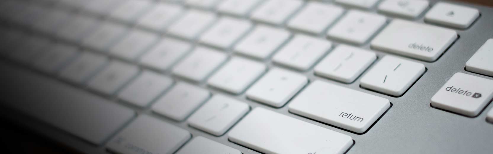Close-up image of a white keyboard.