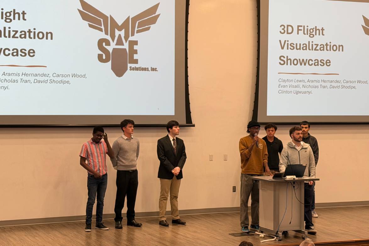 Students on stage presenting