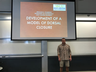 Ben standing in front of presentation