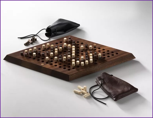 hex board with pegs and bags for those