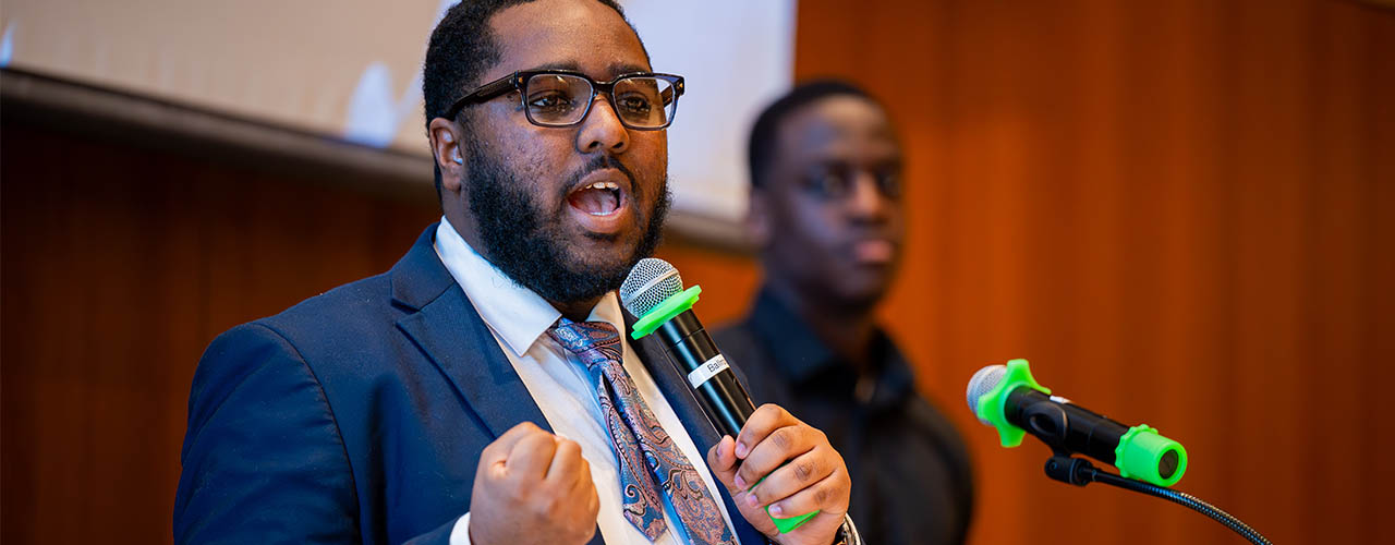 Close up image of preentor with microphone