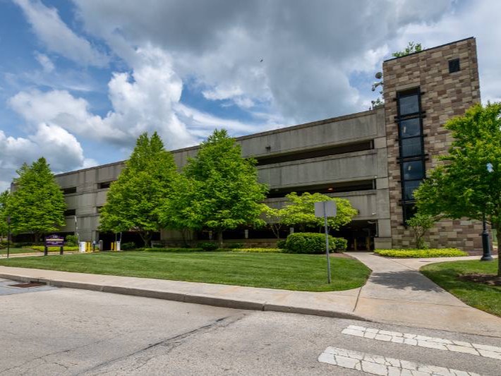 WCU's public safety building with two officers walking out the door